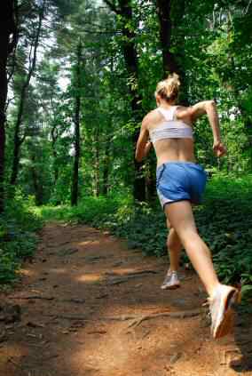 Woman Running in the Forest